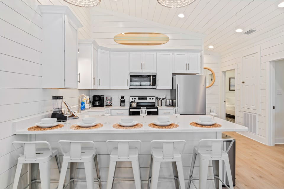 Five barstools provide ample seating for guests to gather, dine, and enjoy great company.
