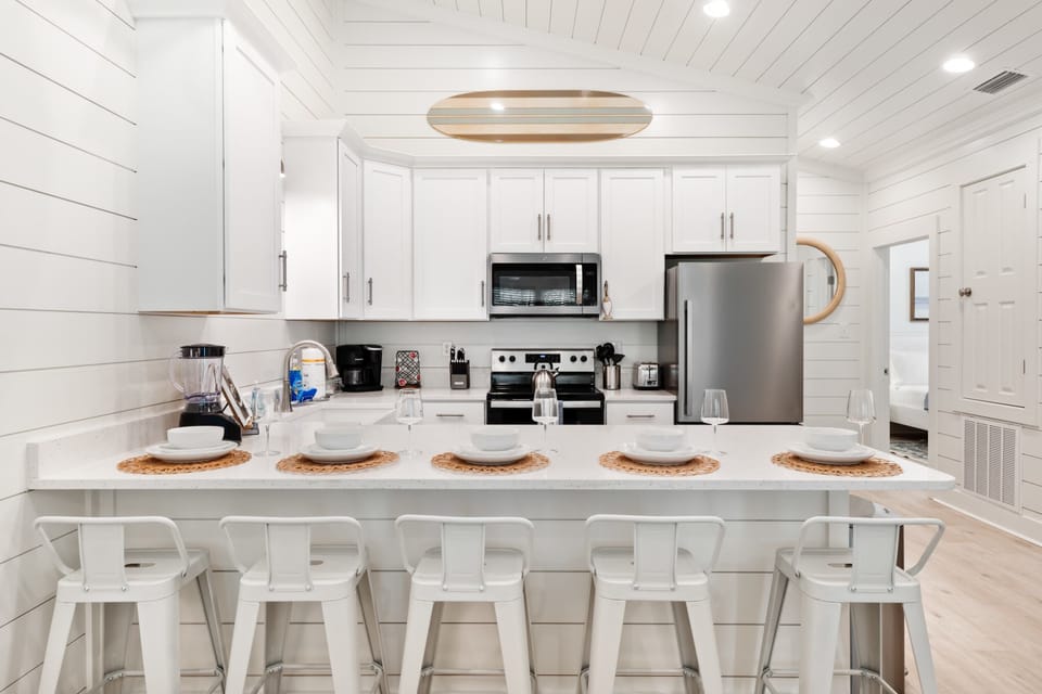 Five barstools provide ample seating for guests to gather, dine, and enjoy great company.