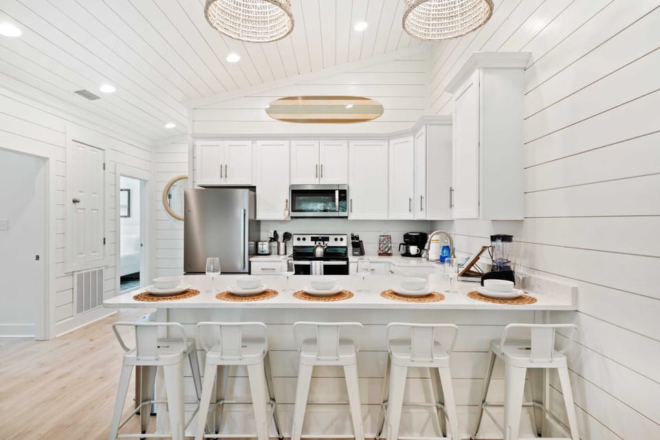 Five barstools provide ample seating for guests to gather, dine, and enjoy great company.