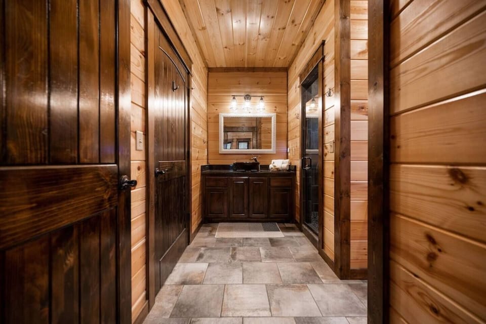 Bathroom ensuite to bedroom #2, accessible to hallway for convenience.