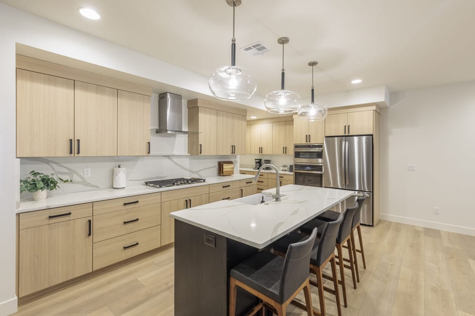 Kitchen - The Kitchen is complete with everything you will need for meal preparations including pots, pans, baking dishes, plates, cups, silverware, cutlery, and an assortment of cooking utensils.
