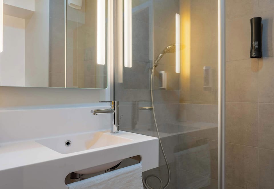 Shower, towels, soap, toilet paper
