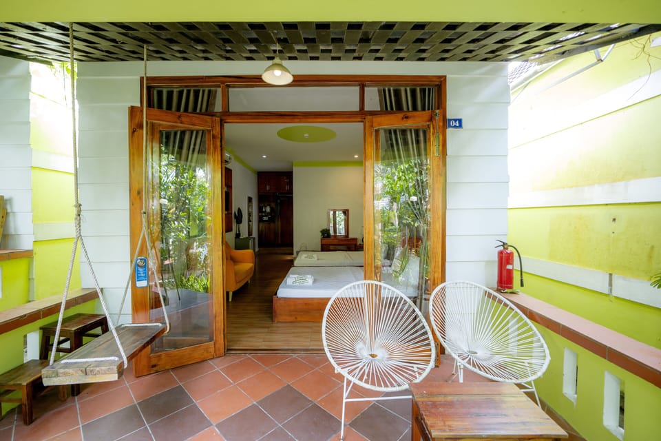 Deluxe Quadruple Room, Garden View | Minibar, desk, blackout drapes, soundproofing