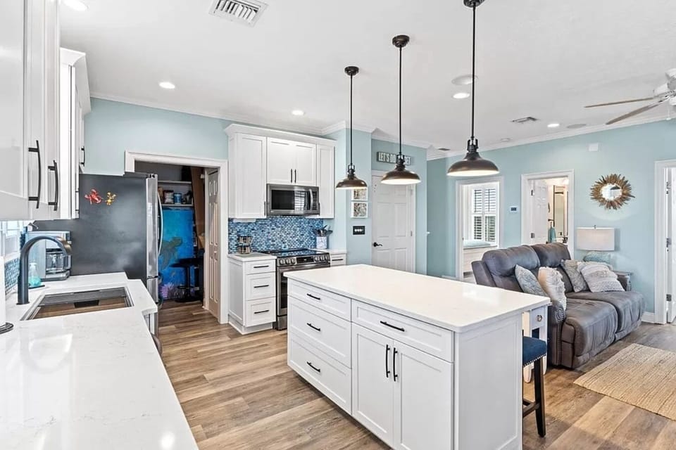 Kitchen island offers another dining location with 3 barstools