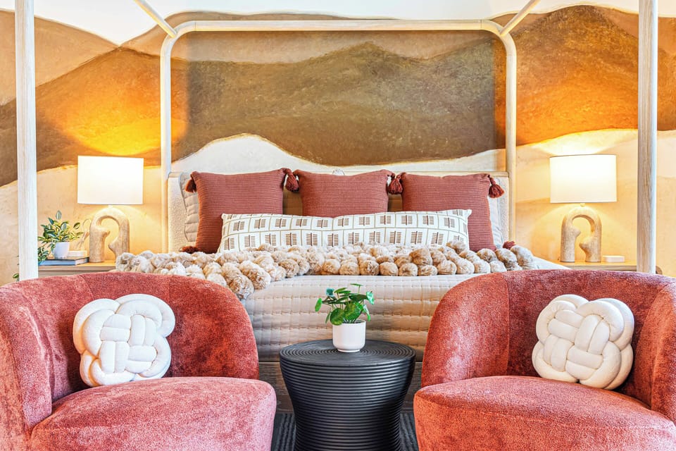 Sleep in luxury in the serene primary bedroom on the top floor, featuring a gorgeous four-post King bed and a calming mountain mural just for you and your own en suite bathroom and private deck with gorgeous mountain views.