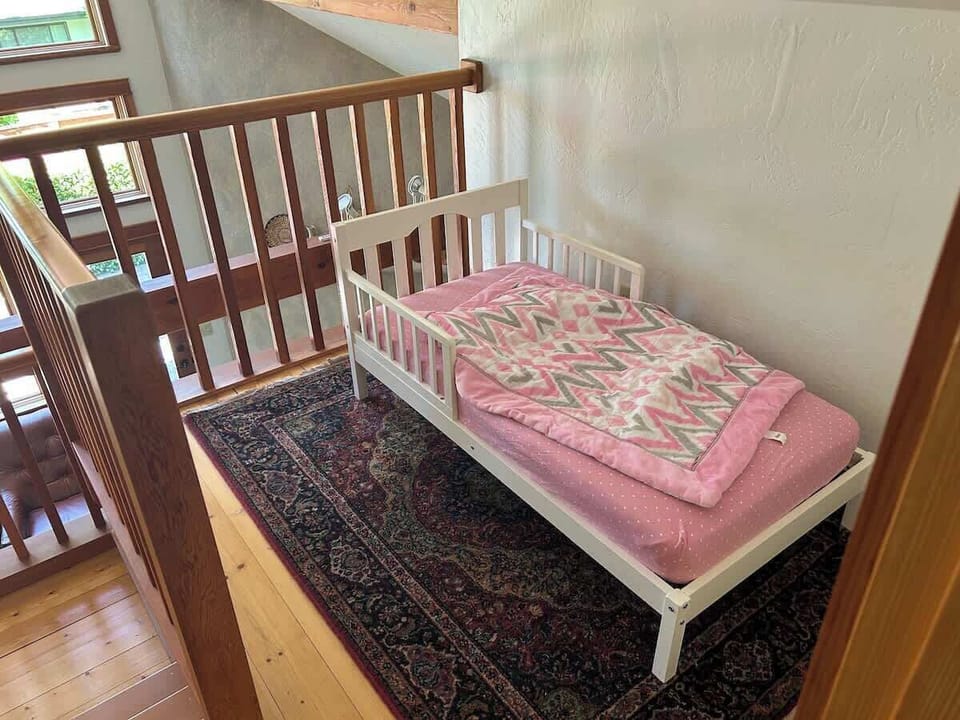 Cozy toddler bed available for little ones—easily moved into the master bedroom or downstairs to fit your family’s needs.