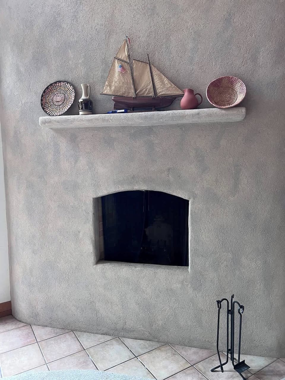 Charming built-in adobe-style fireplace adds unique character to the living room—perfect for cozy evenings after Ducks games.