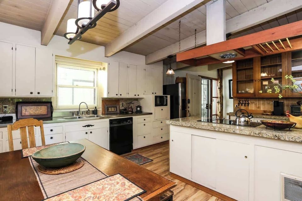 Bright and spacious kitchen with ample counter space for meal prep and plenty of room for everyone to gather. A welcoming hub for cooking, dining, and connection.