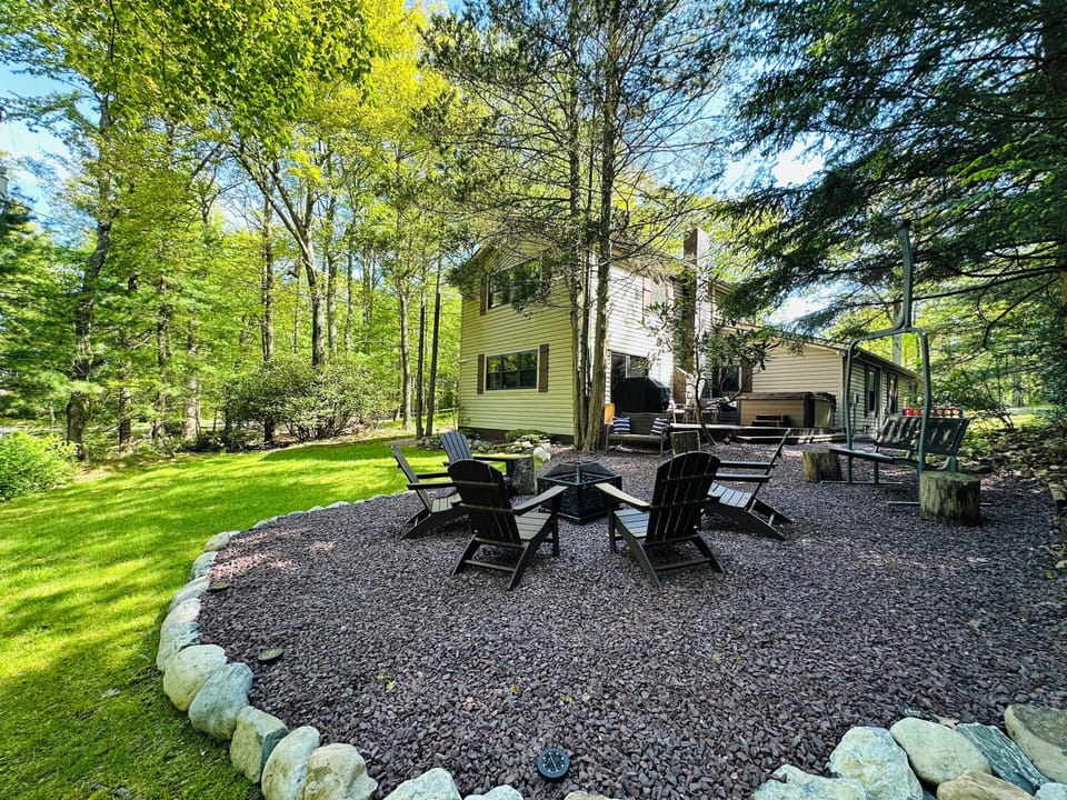 May 2025 Update: Cozy up around the firepit with Adirondack chairs & woods.