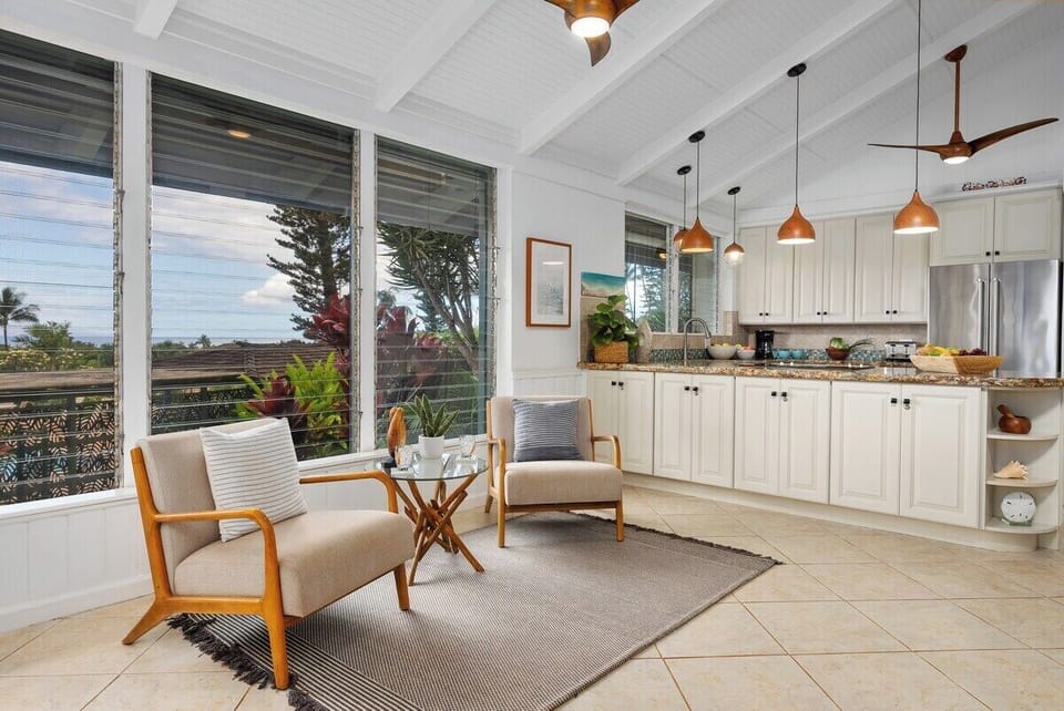 Stylish ceiling fans and pendant lights create a comfortable casual vibe