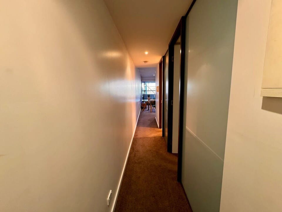 Hallway from bedroom into main living area and balcony