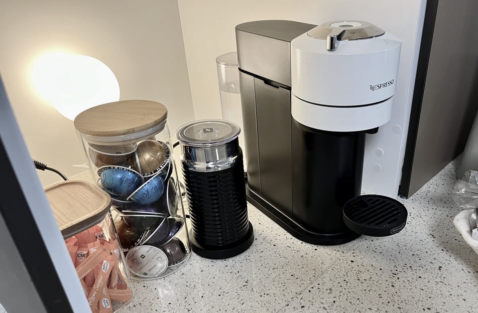 Nespresso, including cappuccino  creamer. Generous coffee pod stocks.