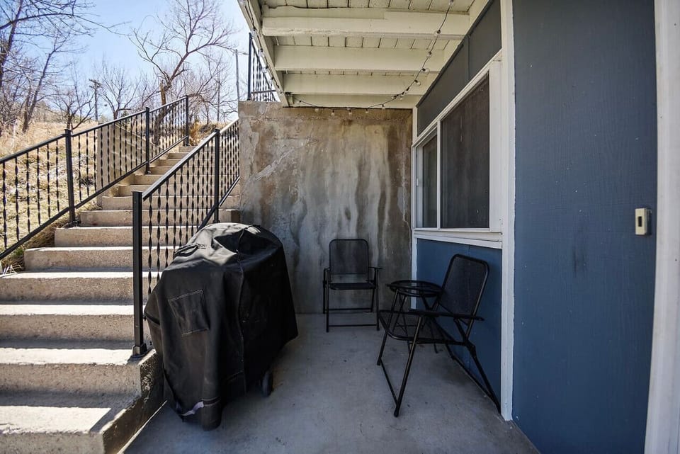 Elevate your outdoor experience with inviting seating arrangements and a versatile gas grill, offering the perfect setting for al fresco dining and memorable gatherings under the open sky.