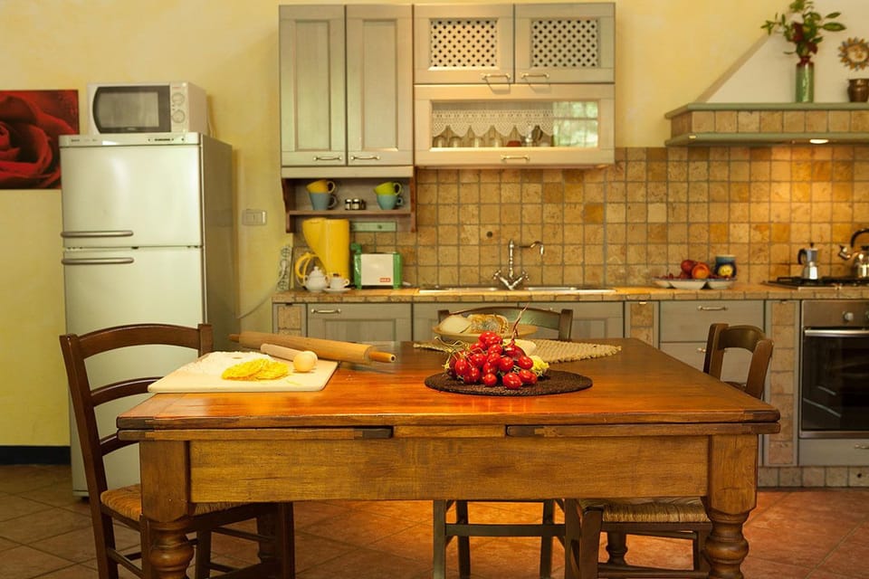 Apartment, 2 Bedrooms | Private kitchen | Full-size fridge, microwave, stovetop, coffee/tea maker