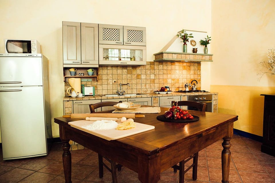 Apartment, 2 Bedrooms | Private kitchen | Full-size fridge, microwave, stovetop, coffee/tea maker