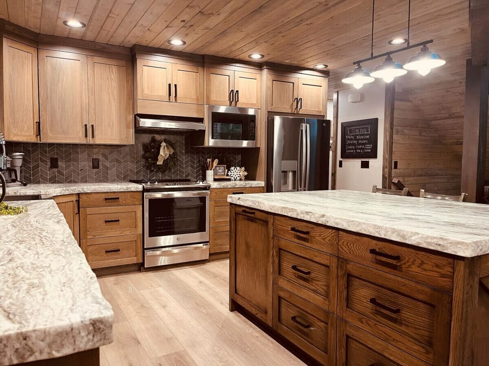Full kitchen with granite countertops and stainless steep appliances 
