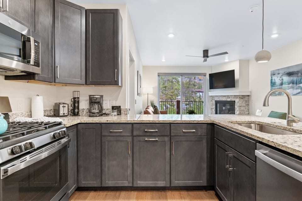 Cook your favorite meals in this fully equipped kitchen with granite counters, stainless appliances, and modern conveniences.