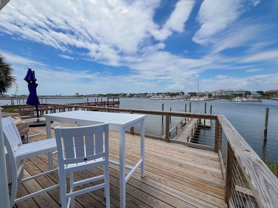 A stunning waterfront property with private dock access overlooking a serene bay. Relax on the spacious deck, soak in panoramic coastal views, and enjoy prime boating opportunities right at your doorstep.