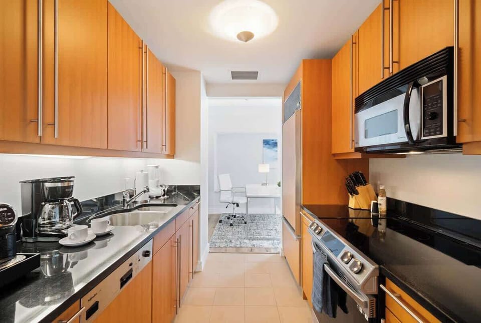 Fully equipped kitchen of the Condo in Miami Florida - Smart use of space with versatile storage solutions - Thoughtful placement of kitchen essentials for easy access