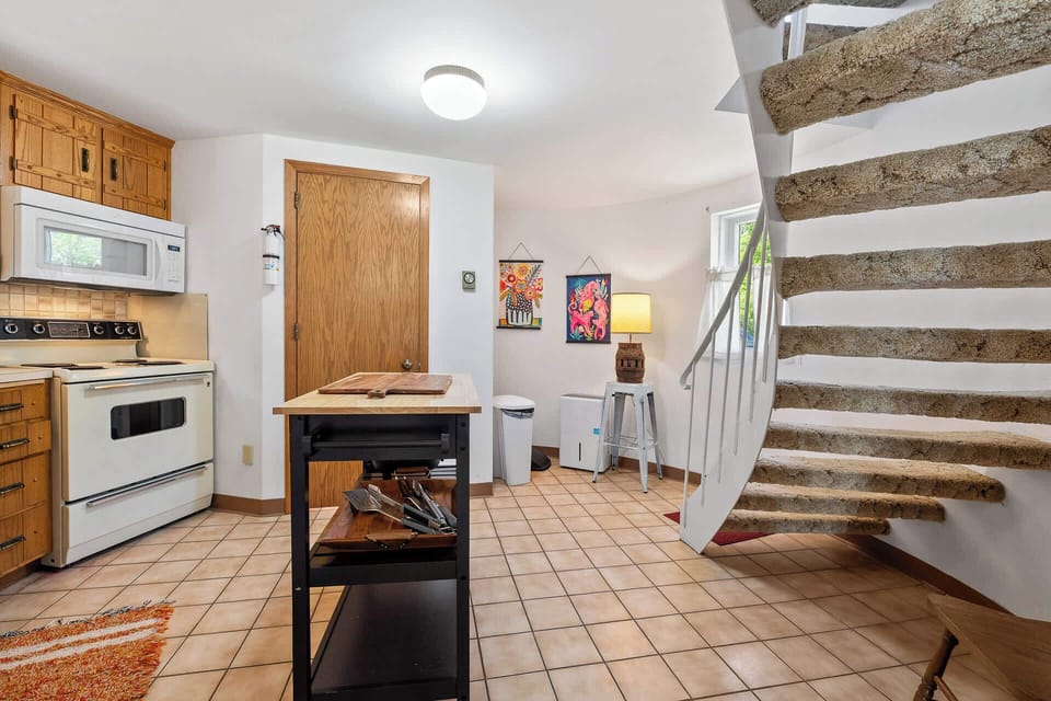 View of Staircase and Bathroom off Kitchen (First Floor)