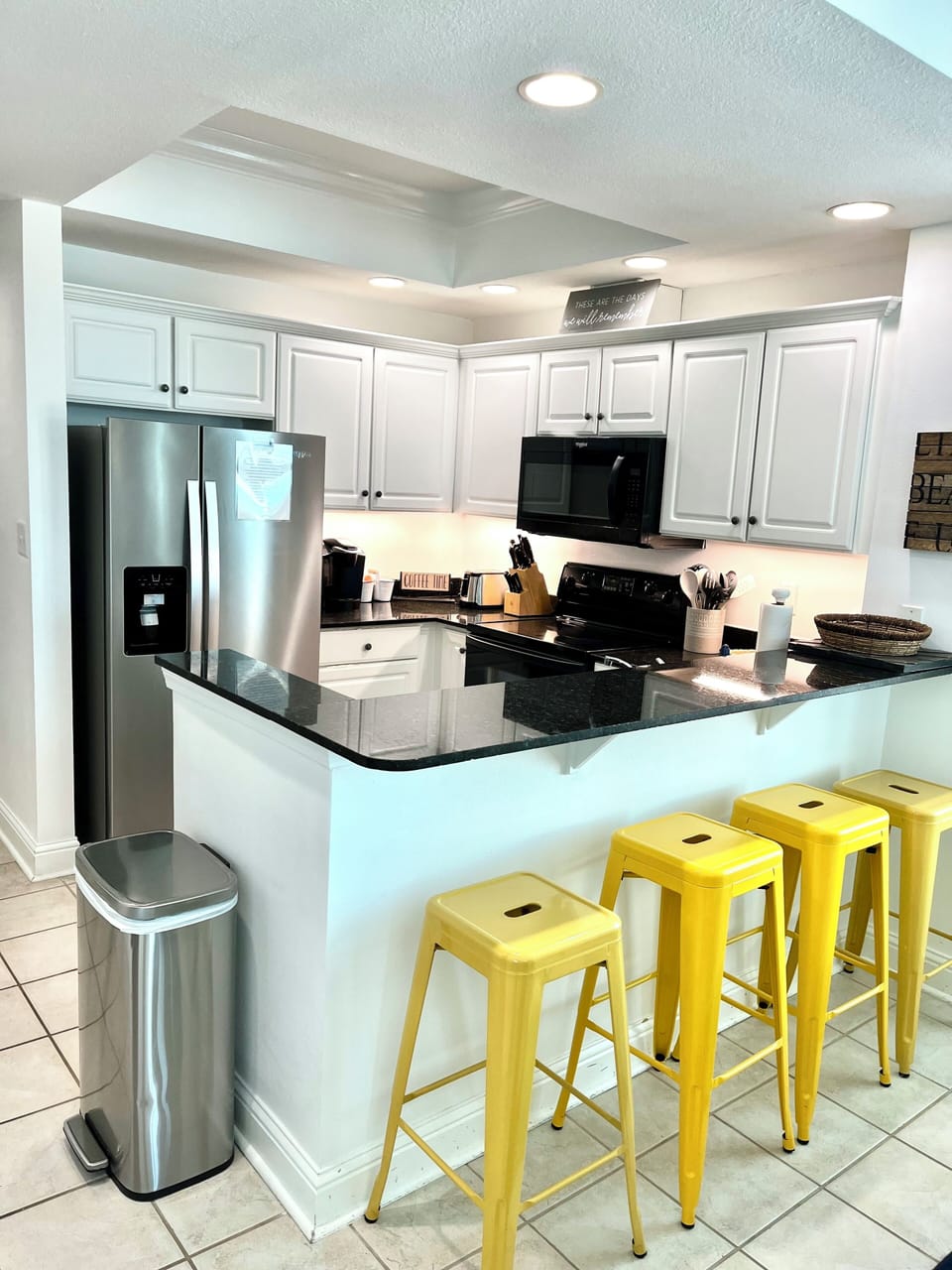 Kitchen with bar counter and seating for 4