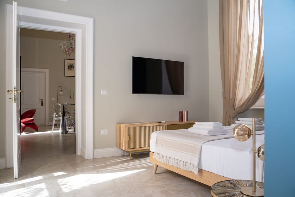 Deluxe Suite, Balcony, Garden View | Frette Italian sheets, premium bedding, down comforters, minibar