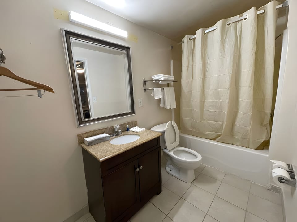 Combined shower/tub, towels, soap, shampoo