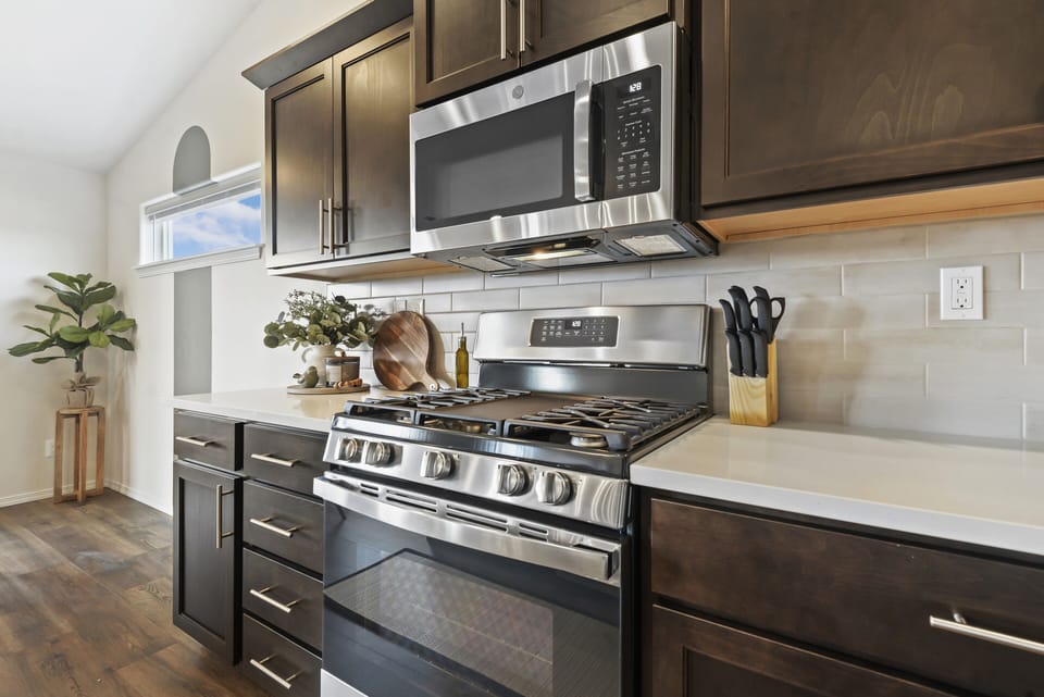 Gas oven has a built in griddle.