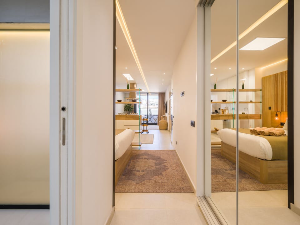Entrance hallway in the accommodation. Mirrored wardrobes.