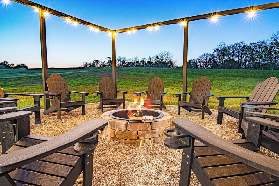 Gather around the fire pit under the twinkling lights and starry sky!