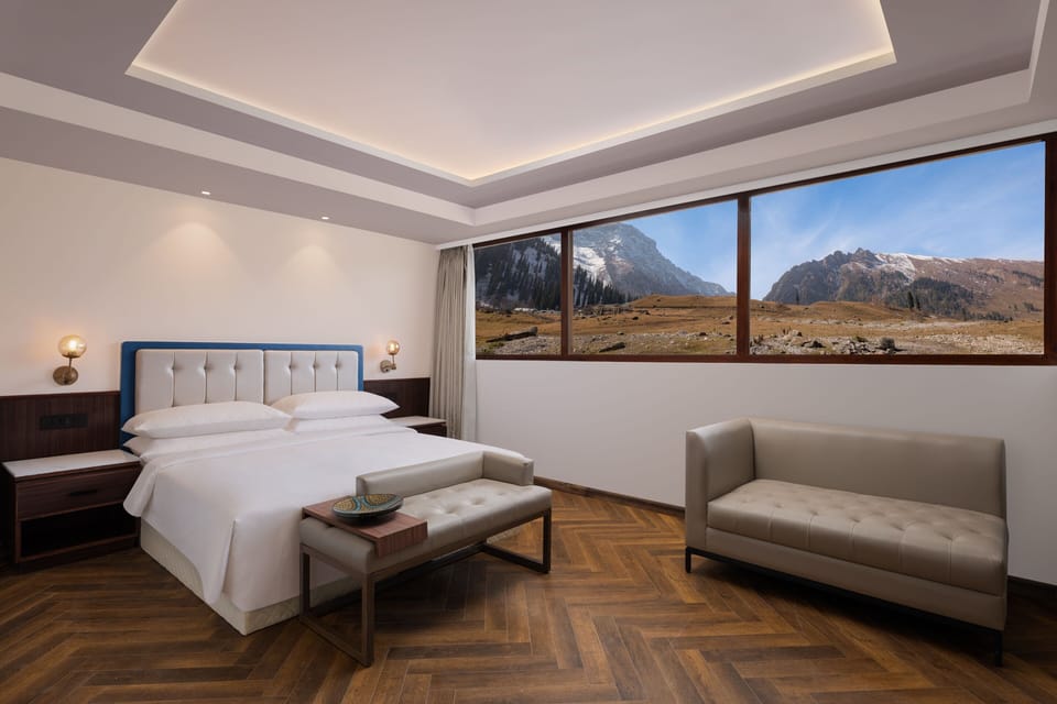 Junior Suite, 1 King Bed, Mountain View | Minibar, in-room safe, desk, laptop workspace