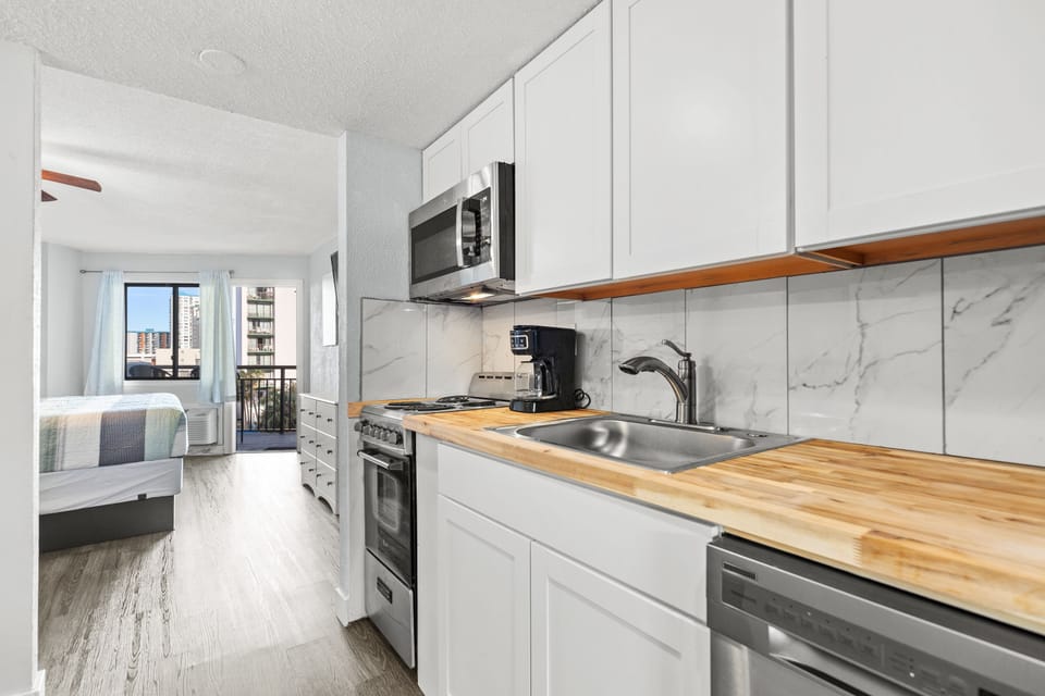 Culinary inspiration starts in the fully equipped kitchen of our chic suite!