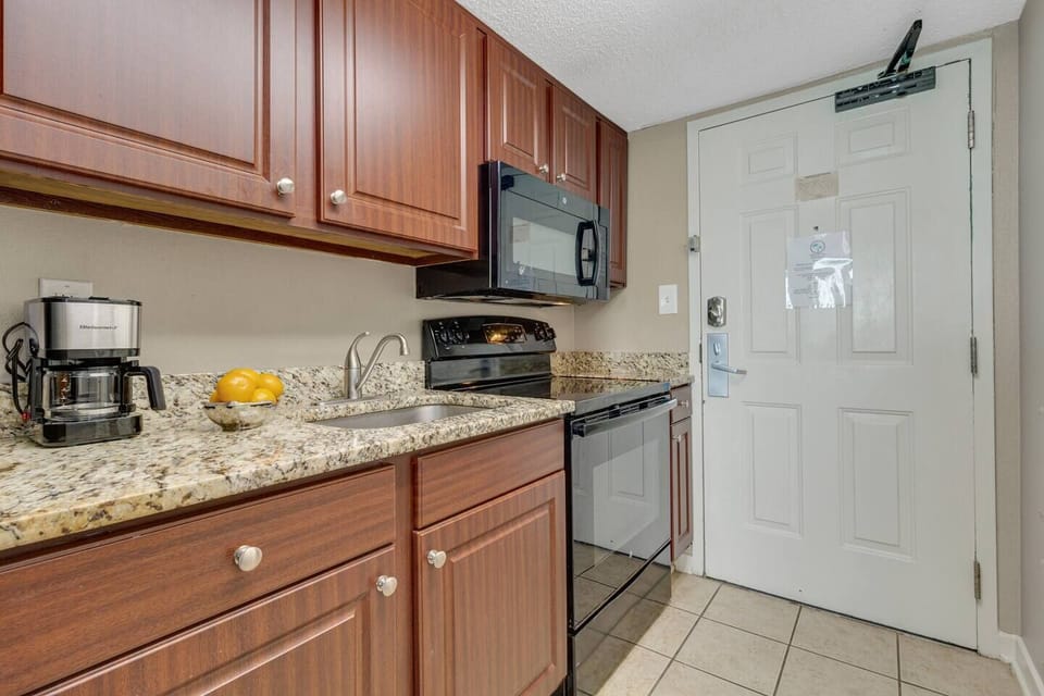 The cozy layout seamlessly connects the suite and kitchen, where modern appliances await your culinary creations.