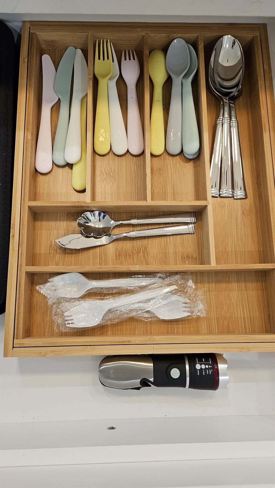 Even the littlest family members are covered with child-friendly utensils ready in the drawer.