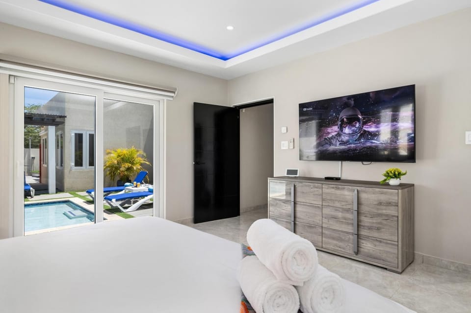 Wake up and watch TV, then slide open the doors for a refreshing dip in the pool.
