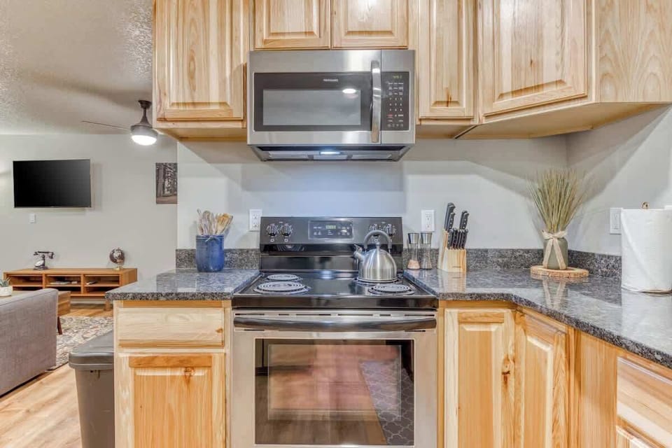 Cook in style in our fully-stocked kitchen featuring top-tier appliances! Everything you need for gourmet meals during your stay. 