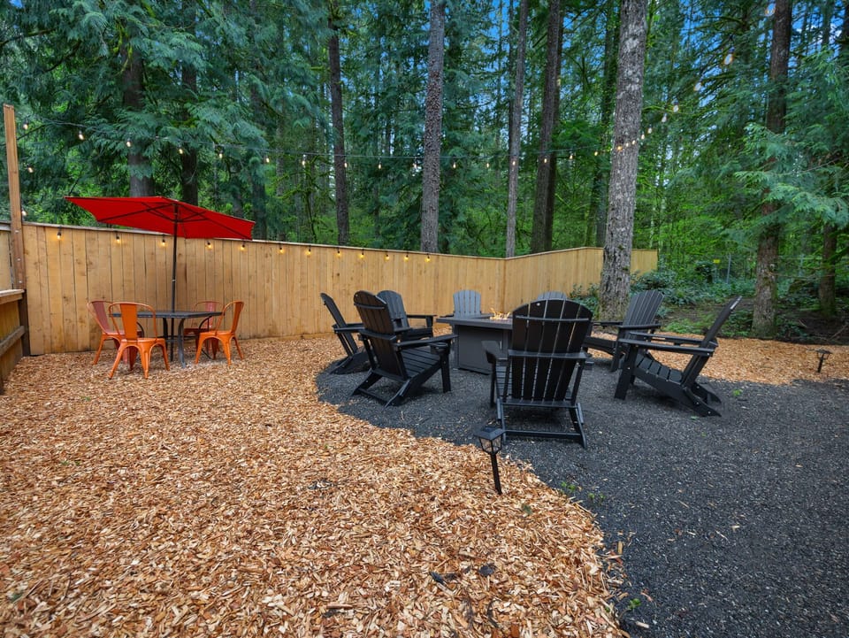 Gather under the string lights! Enjoy the fire pit in Adirondack chairs or dine al fresco.
