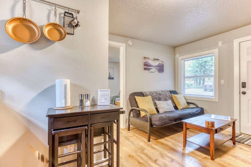 Seamlessly dine & relax! Enjoy our small dining area steps from the modern living room.