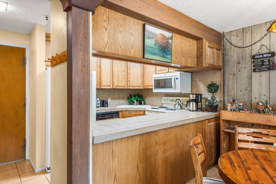 A full kitchen and dining area make it so easy to enjoy dining in during your stay.  With the village right next door dining out is also a breeze!