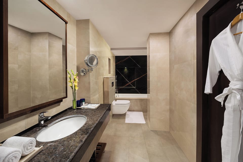 Presidential Suite | Bathroom | Shower, rainfall showerhead, hair dryer, slippers