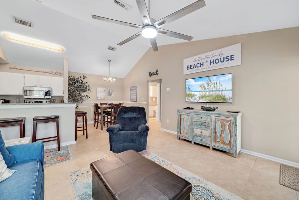 The living, dining, and kitchen areas blend together seamlessly to provide a comfortable transition from room to room.