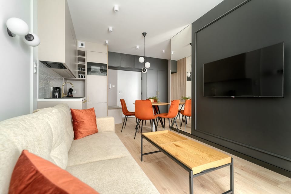 Deluxe Apartment, City View | Living area | 130-cm flat-screen TV with cable channels