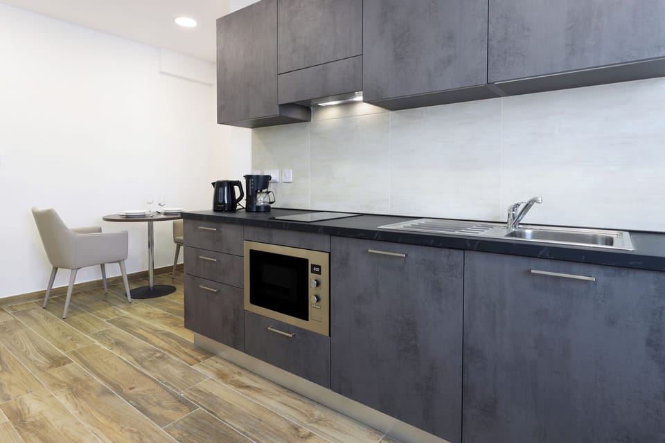Standard Studio, City View | Private kitchen | Mini-fridge, microwave, oven, stovetop