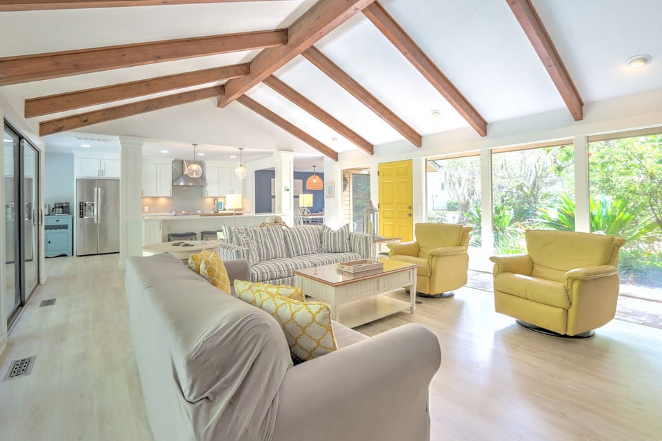 Living Room with Flat Screen TV and Pool Views