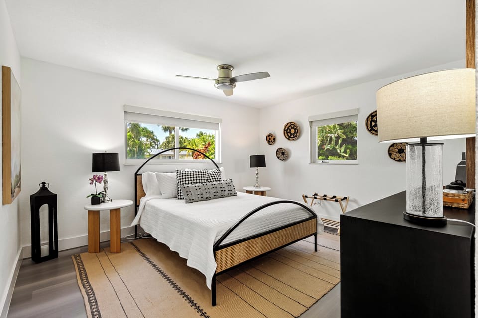Queen bedroom with bathroom and flat screen TV.