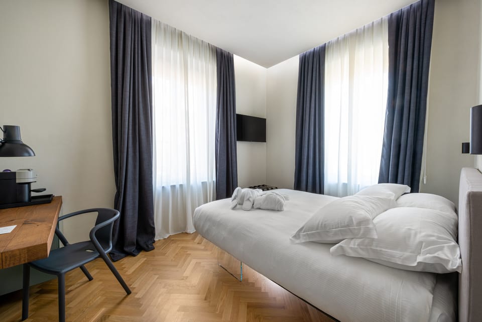 Superior Room, Courtyard View | Egyptian cotton sheets, premium bedding, down comforters, minibar
