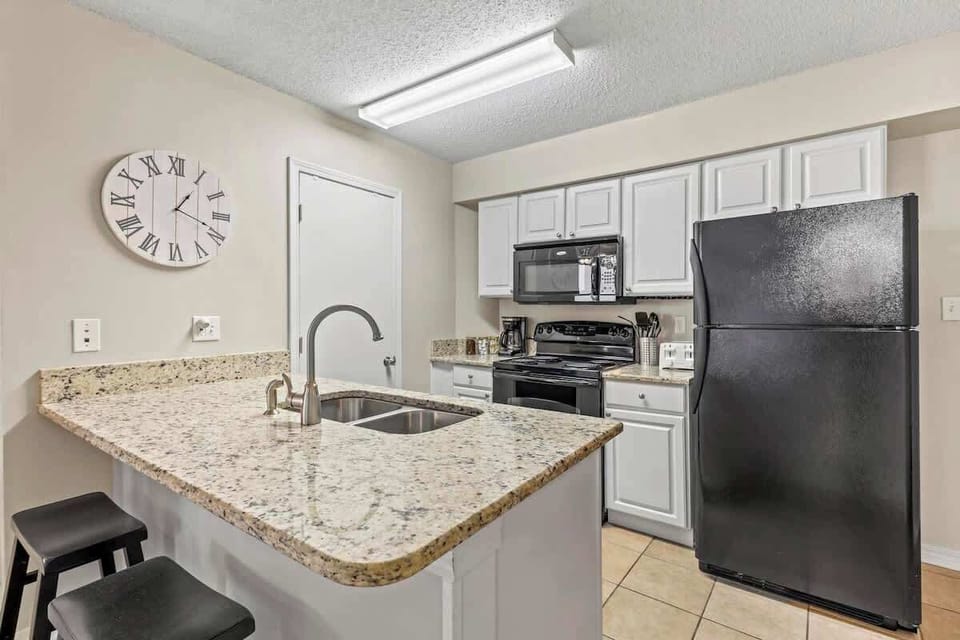 (105 -KITCHEN) A fully equipped kitchen with spices, cookware and ice maker. Plus coffee bar with coffee, creamer and sugar.