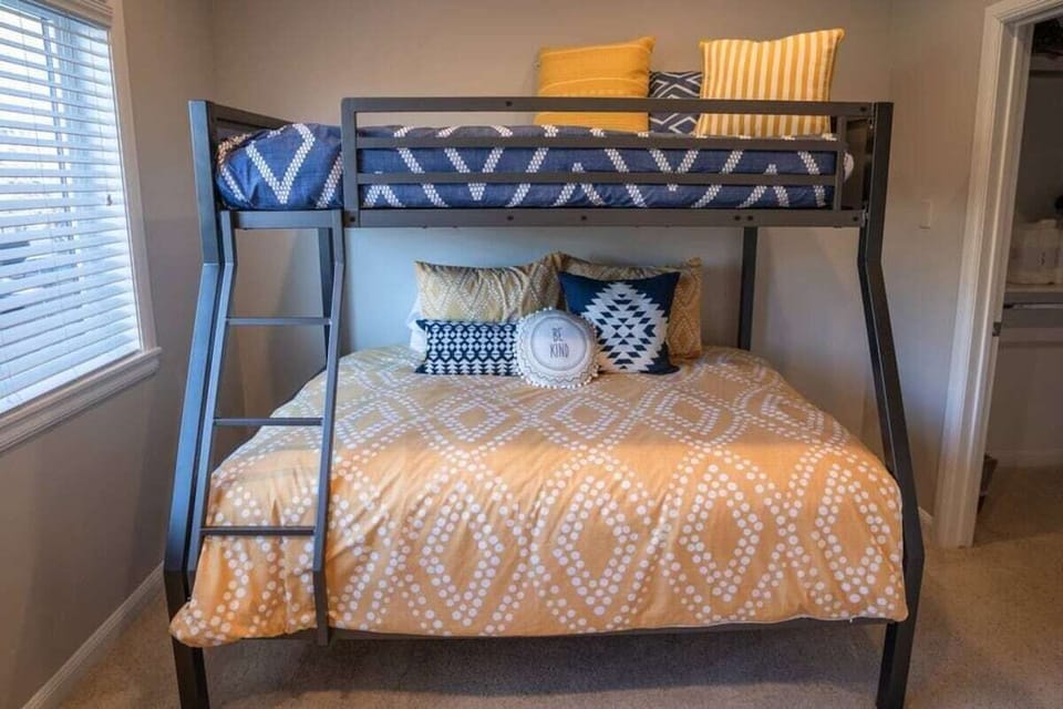 The second bedroom is outfitted luxurious linens, and plush pillows.