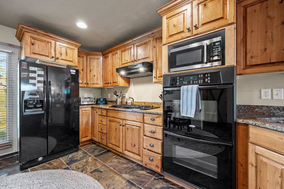 The large refrigerator has an ice maker and plenty of room to store your groceries.