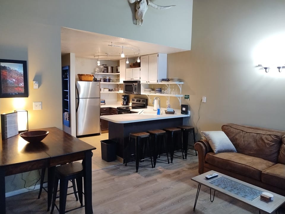 Open-concept living, dining, and kitchen area designed for easy gathering with family and friends.